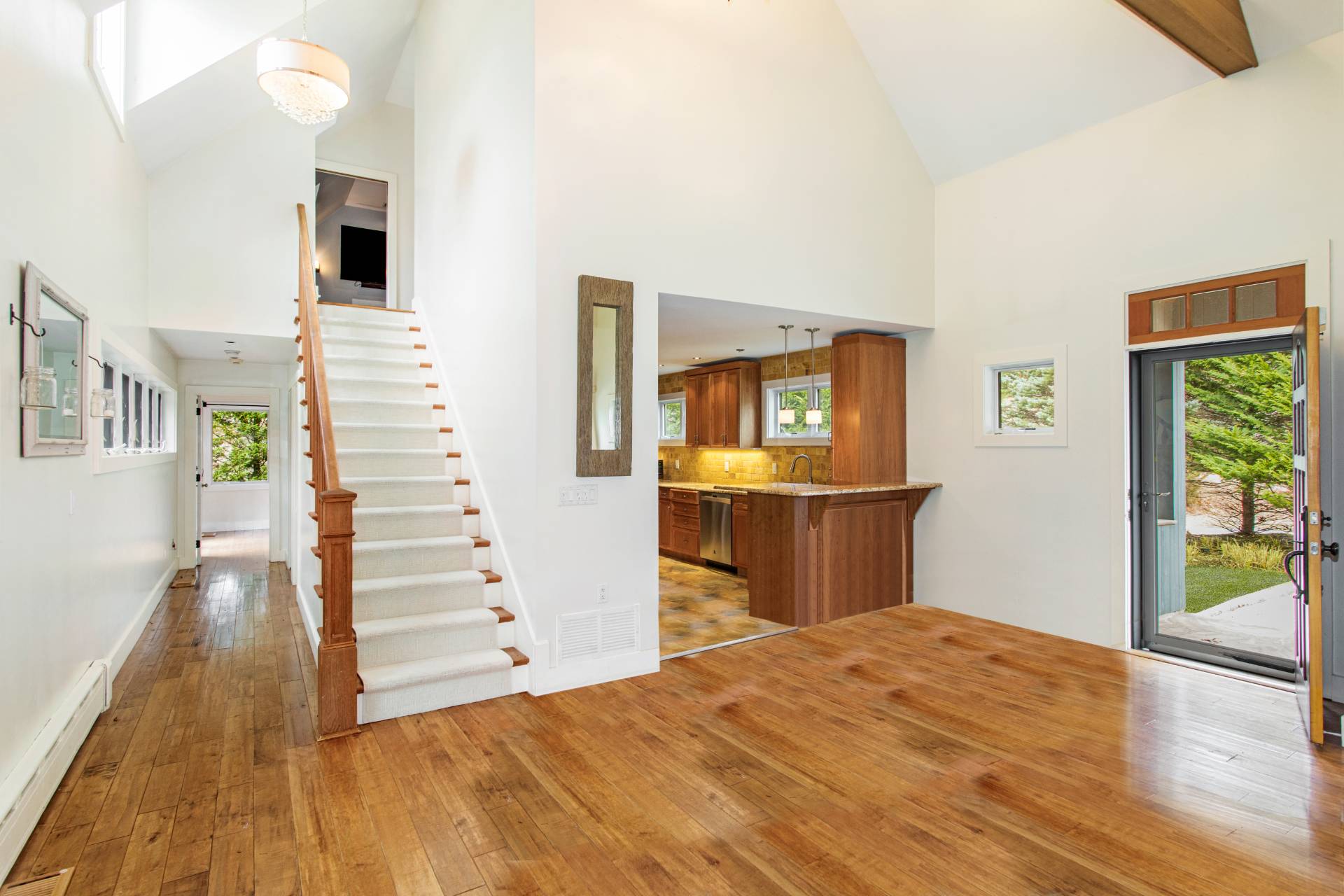 1095 Millstone Road Sag Harbor, NY 11963 - Photo 12 of 19 a view of a bedroom with wooden floor and hallway