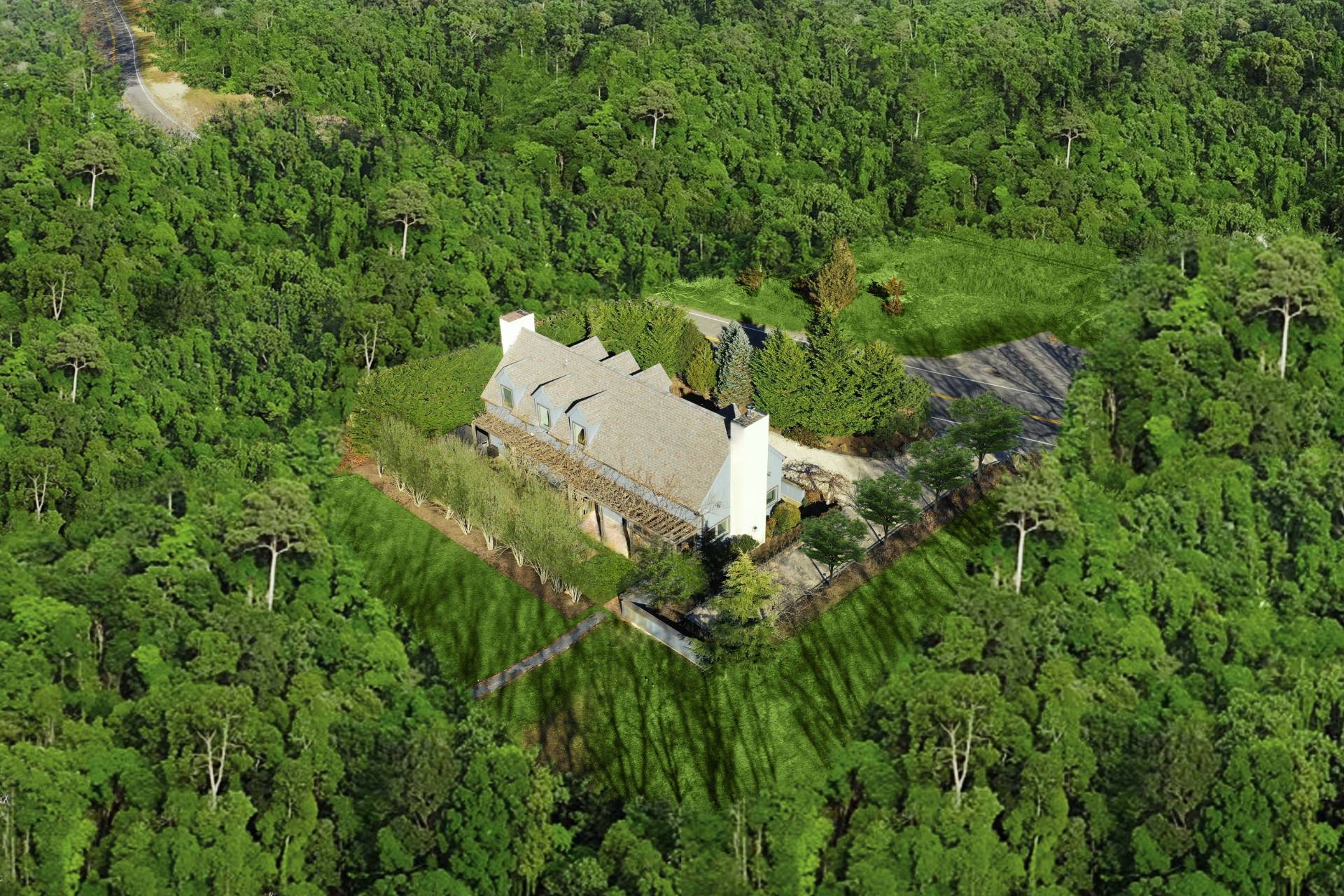 1095 Millstone Road Sag Harbor, NY 11963 - Photo 4 of 19 an aerial view of residential house with outdoor space and trees all around