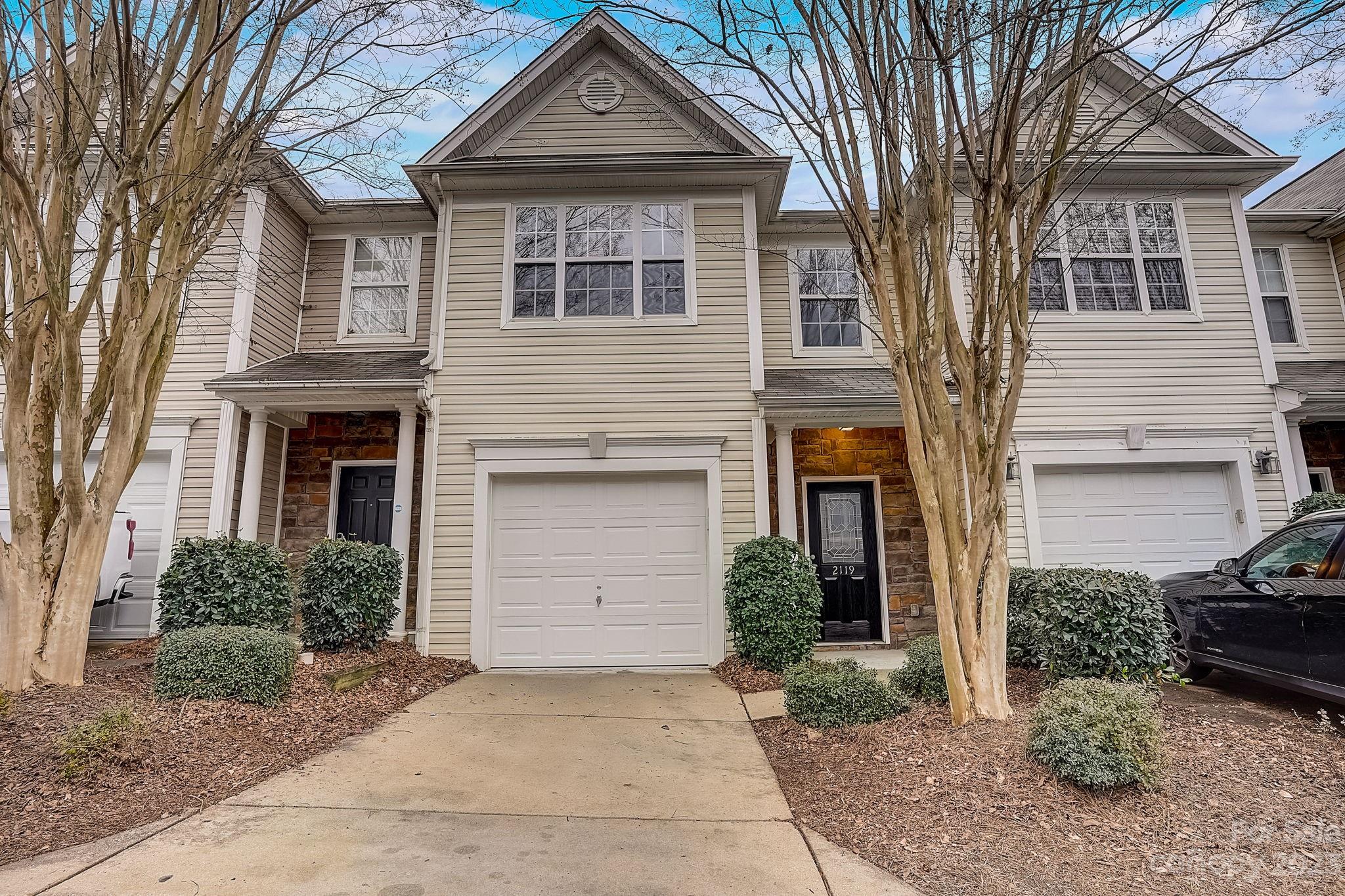 2119 Midnight Blue Lane Fort Mill, SC 29708 - Photo 1 of 15 a front view of a house with garden