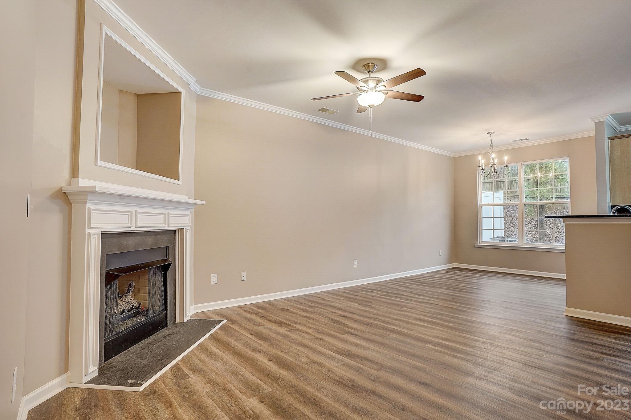 2119 Midnight Blue Lane Fort Mill, SC 29708 - Photo 2 of 15 a view of empty room with wooden floor and fan