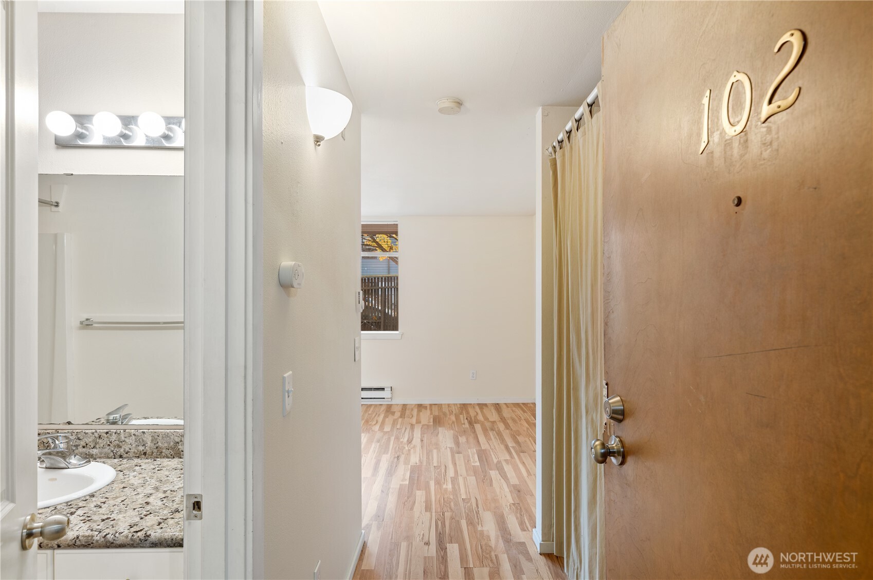 802 North 43rd Street Seattle, WA 98103 - Photo 8 of 18 view of a bathroom with a shower and a mirror