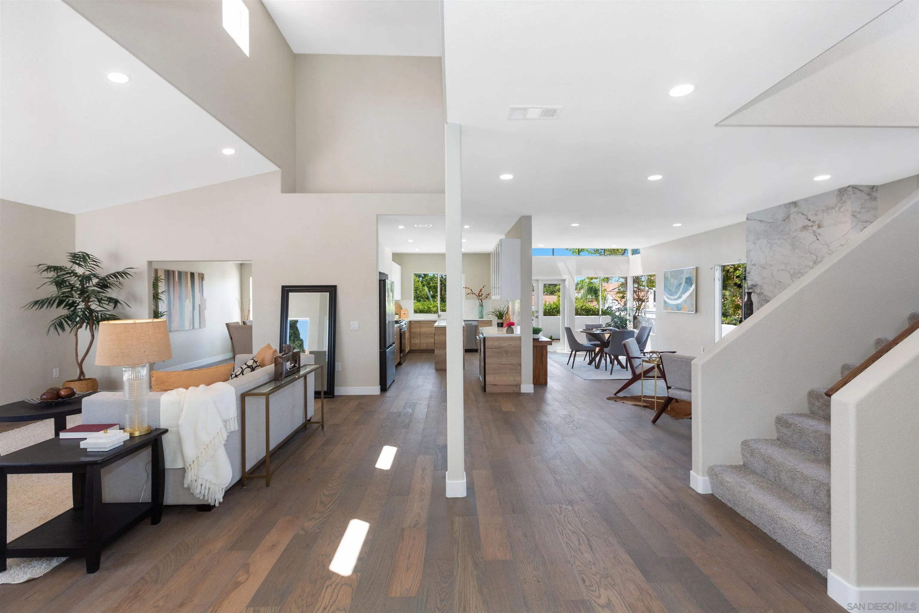 4963 Pylos Way Oceanside, CA 92056 - Photo 11 of 53 a living room with furniture and a wooden floor