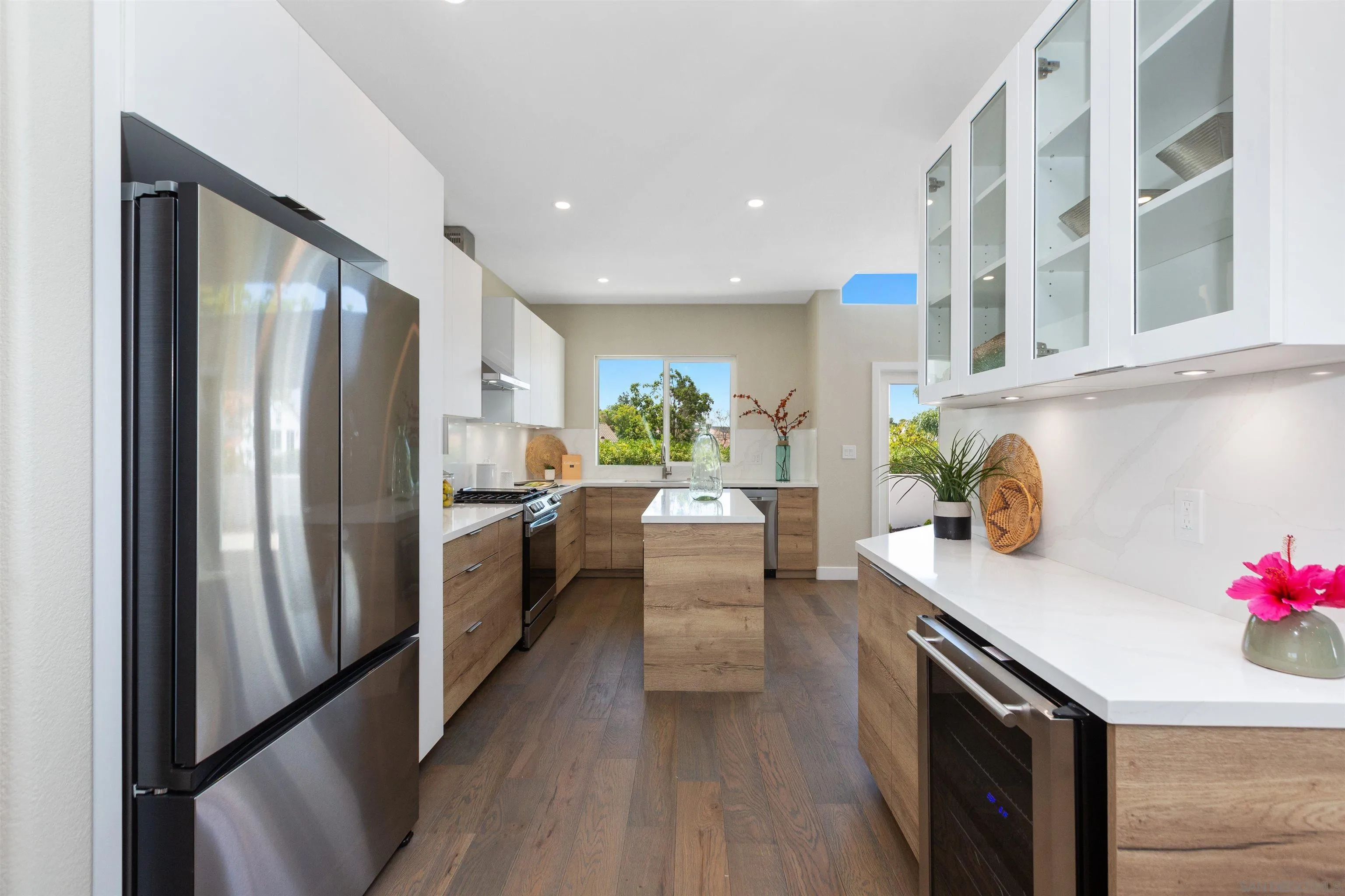 4963 Pylos Way Oceanside, CA 92056 - Photo 15 of 53 a kitchen with stainless steel appliances a refrigerator and a stove