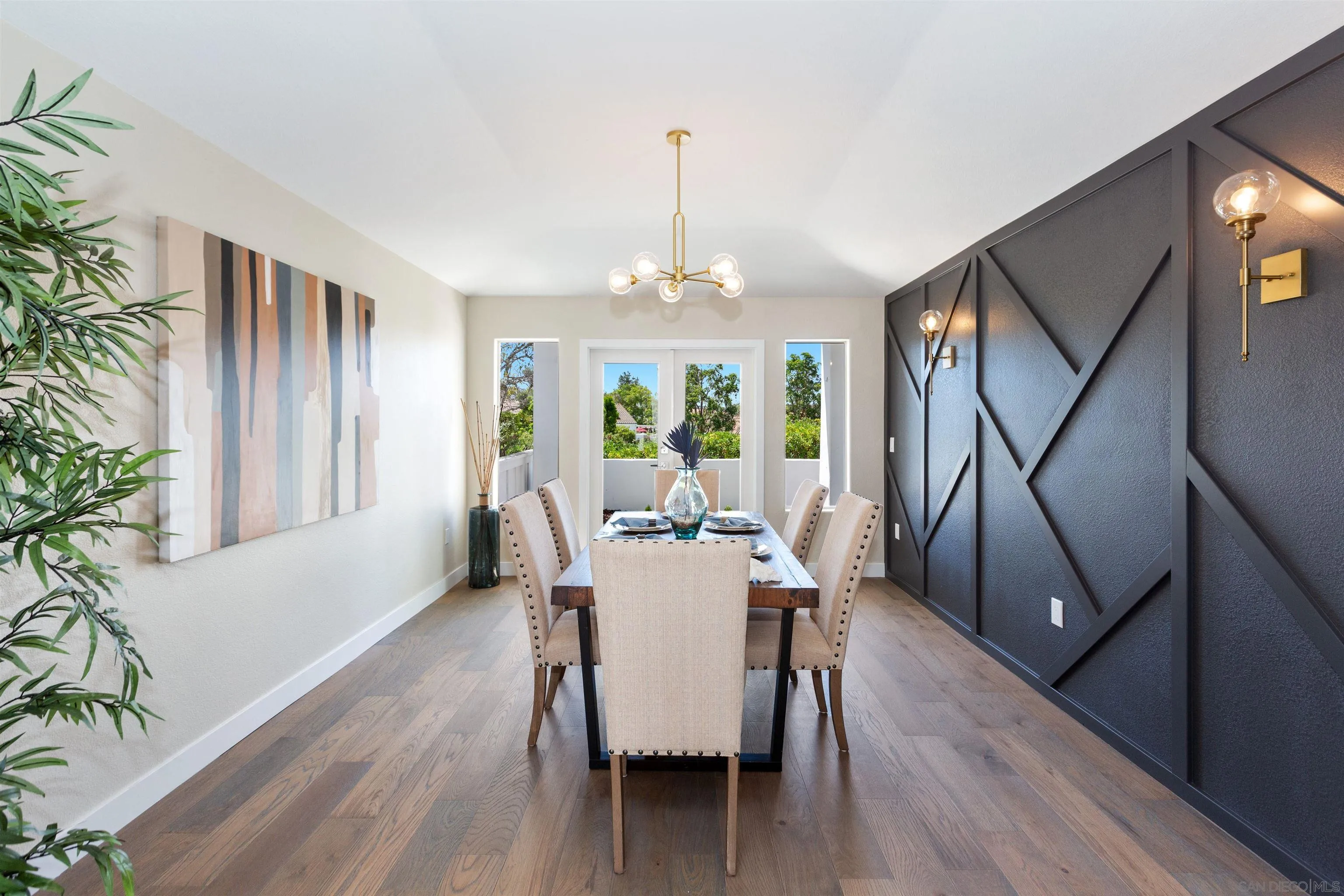 4963 Pylos Way Oceanside, CA 92056 - Photo 22 of 53 a view of a dining room with furniture window and wooden floor