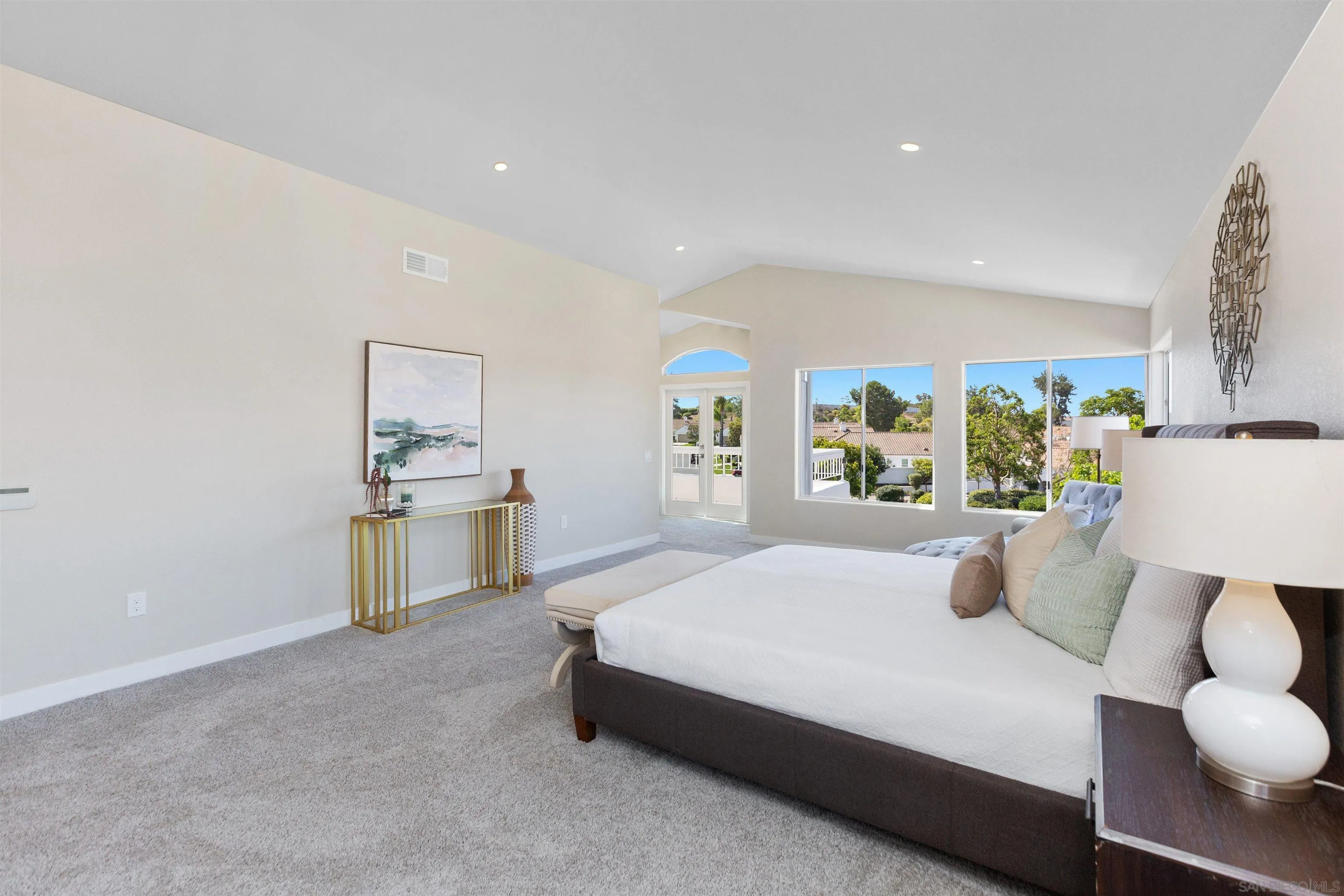 4963 Pylos Way Oceanside, CA 92056 - Photo 26 of 53 a bedroom with a bed and a table