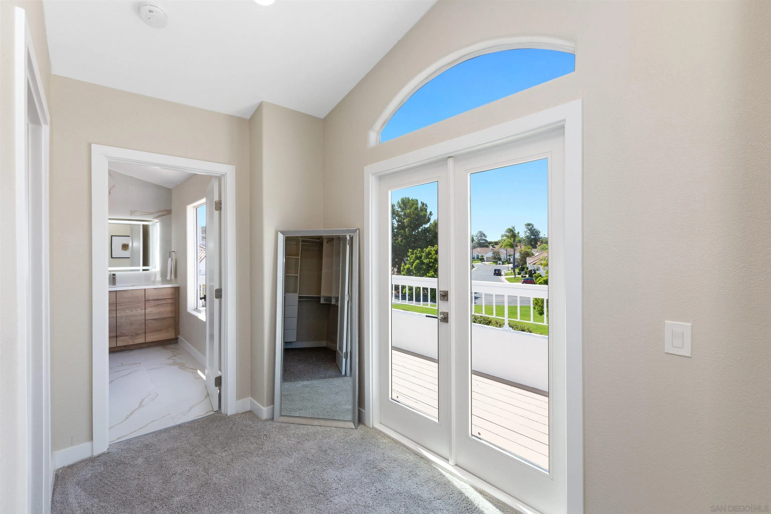 4963 Pylos Way Oceanside, CA 92056 - Photo 27 of 53 a view of a hallway with a livingroom and a livingroom with furniture