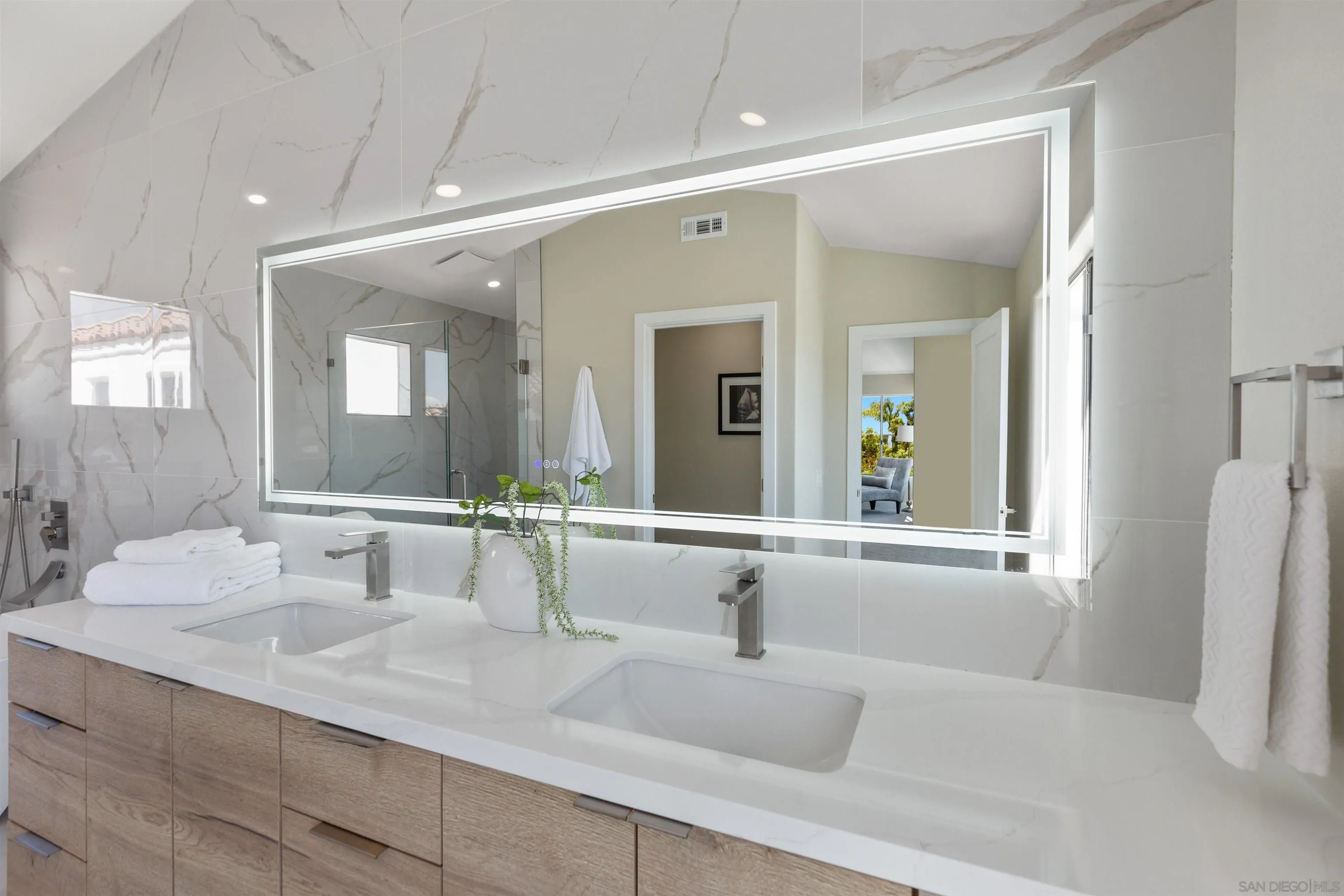 4963 Pylos Way Oceanside, CA 92056 - Photo 29 of 53 a bathroom with a sink and a mirror