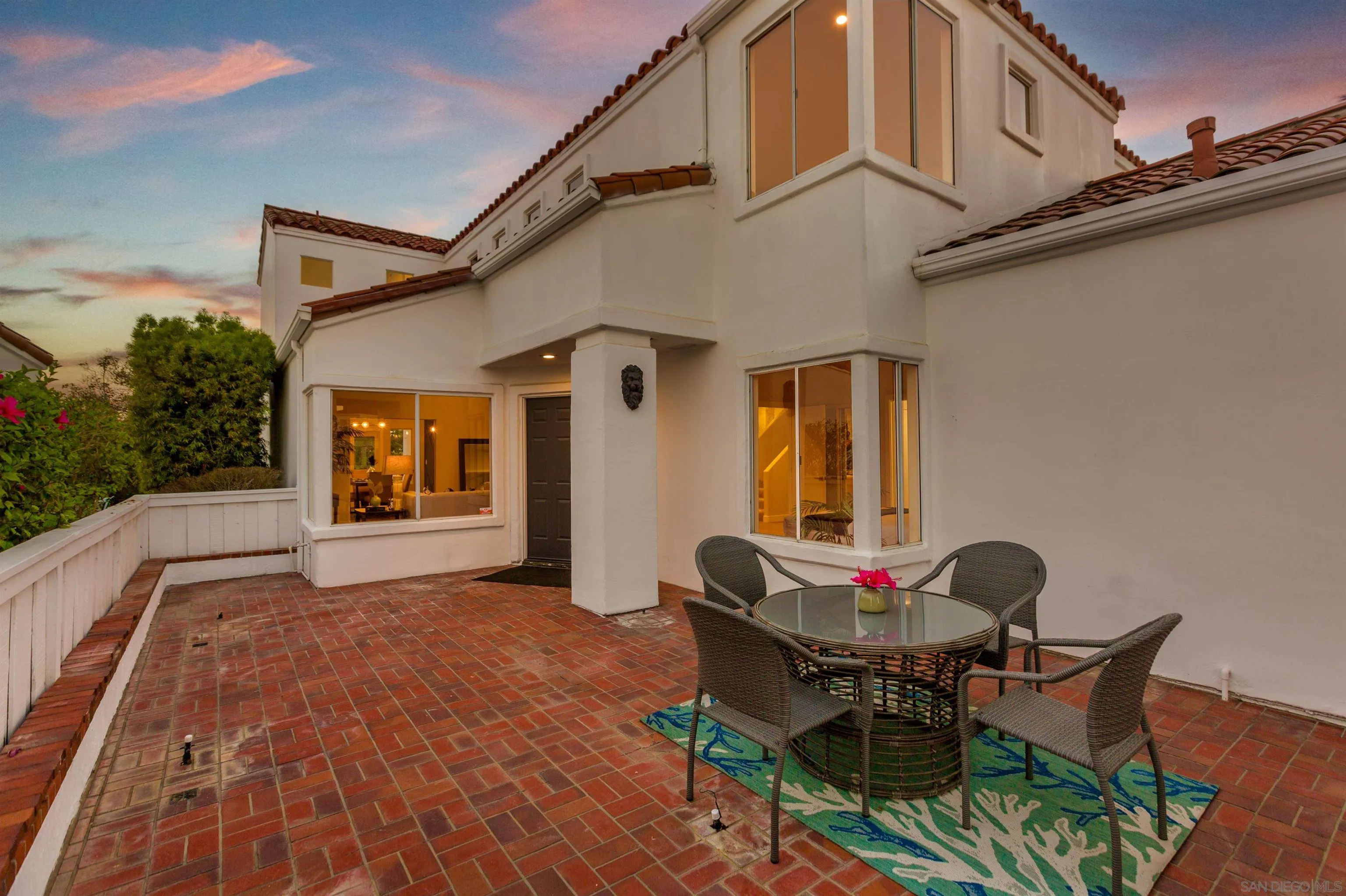 4963 Pylos Way Oceanside, CA 92056 - Photo 3 of 53 a backyard of a house with table and chairs