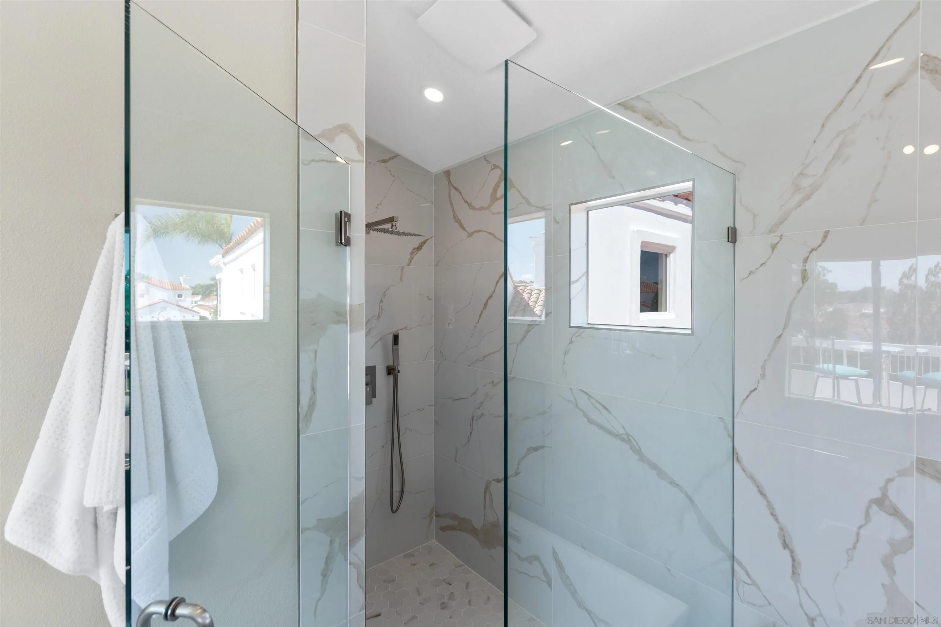 4963 Pylos Way Oceanside, CA 92056 - Photo 33 of 53 a bathroom with a shower and a tub