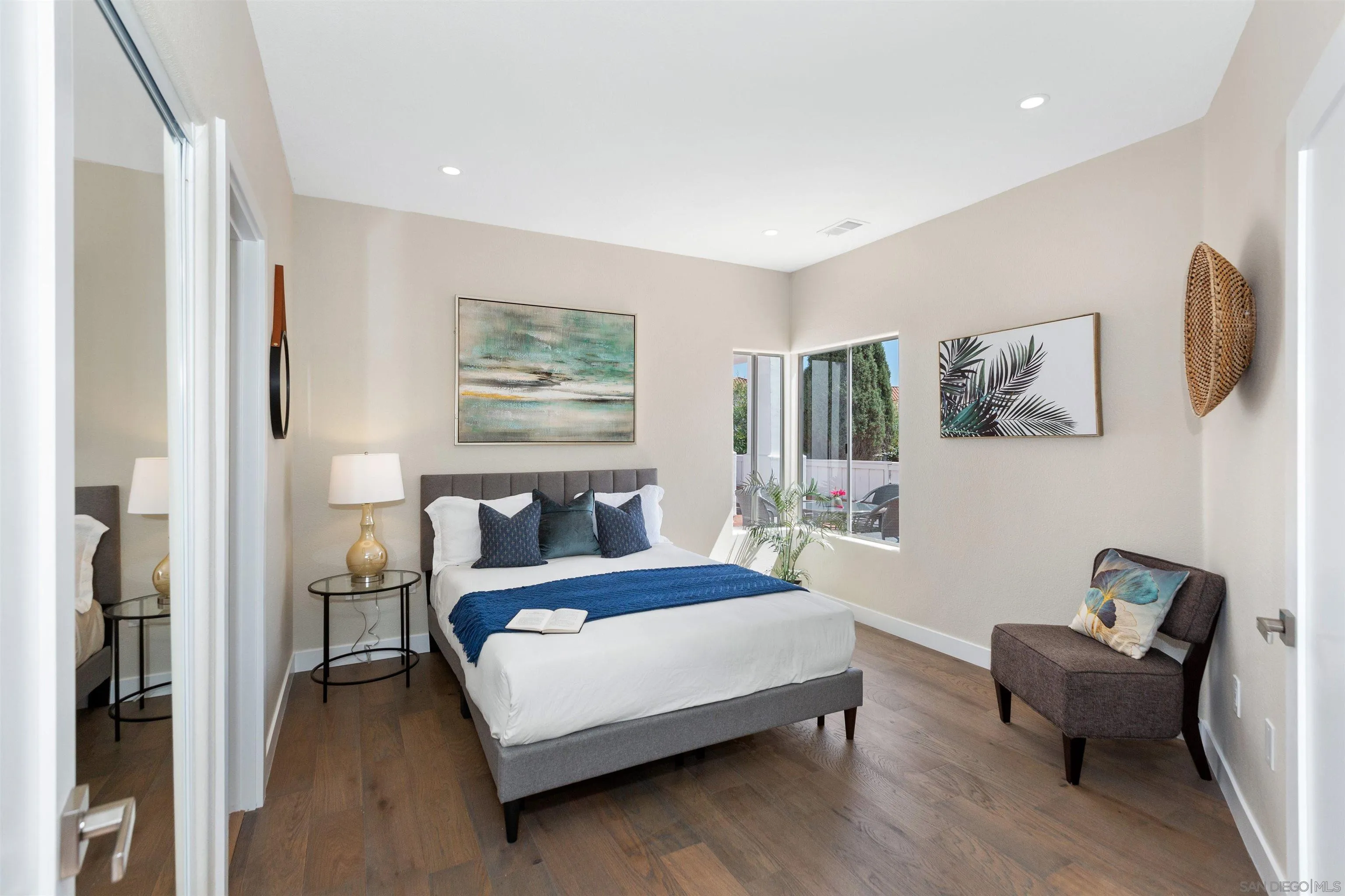 4963 Pylos Way Oceanside, CA 92056 - Photo 40 of 53 a bedroom with a bed couch and a window