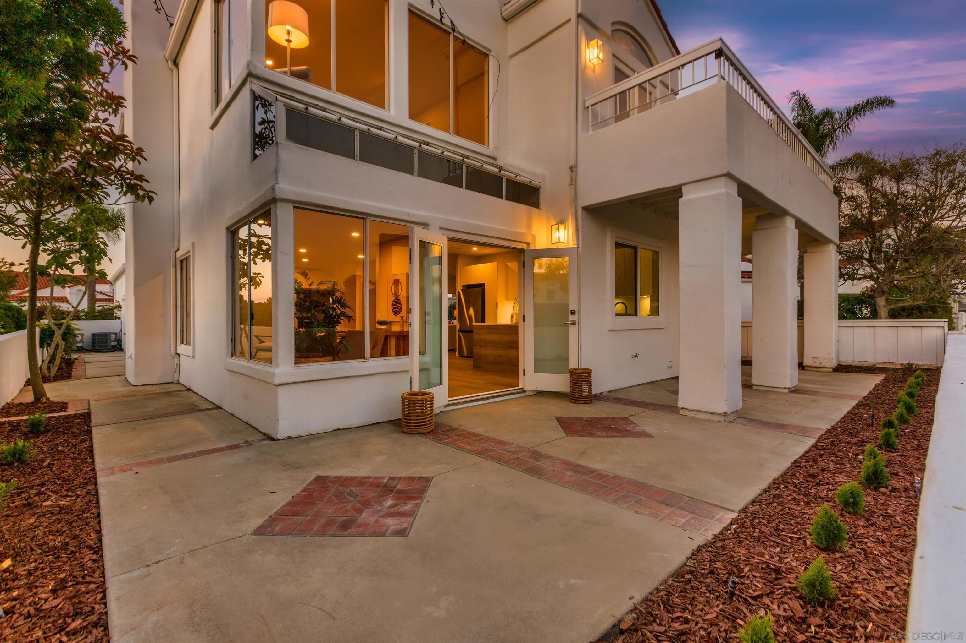 4963 Pylos Way Oceanside, CA 92056 - Photo 4 of 53 a view of a building with a outdoor space