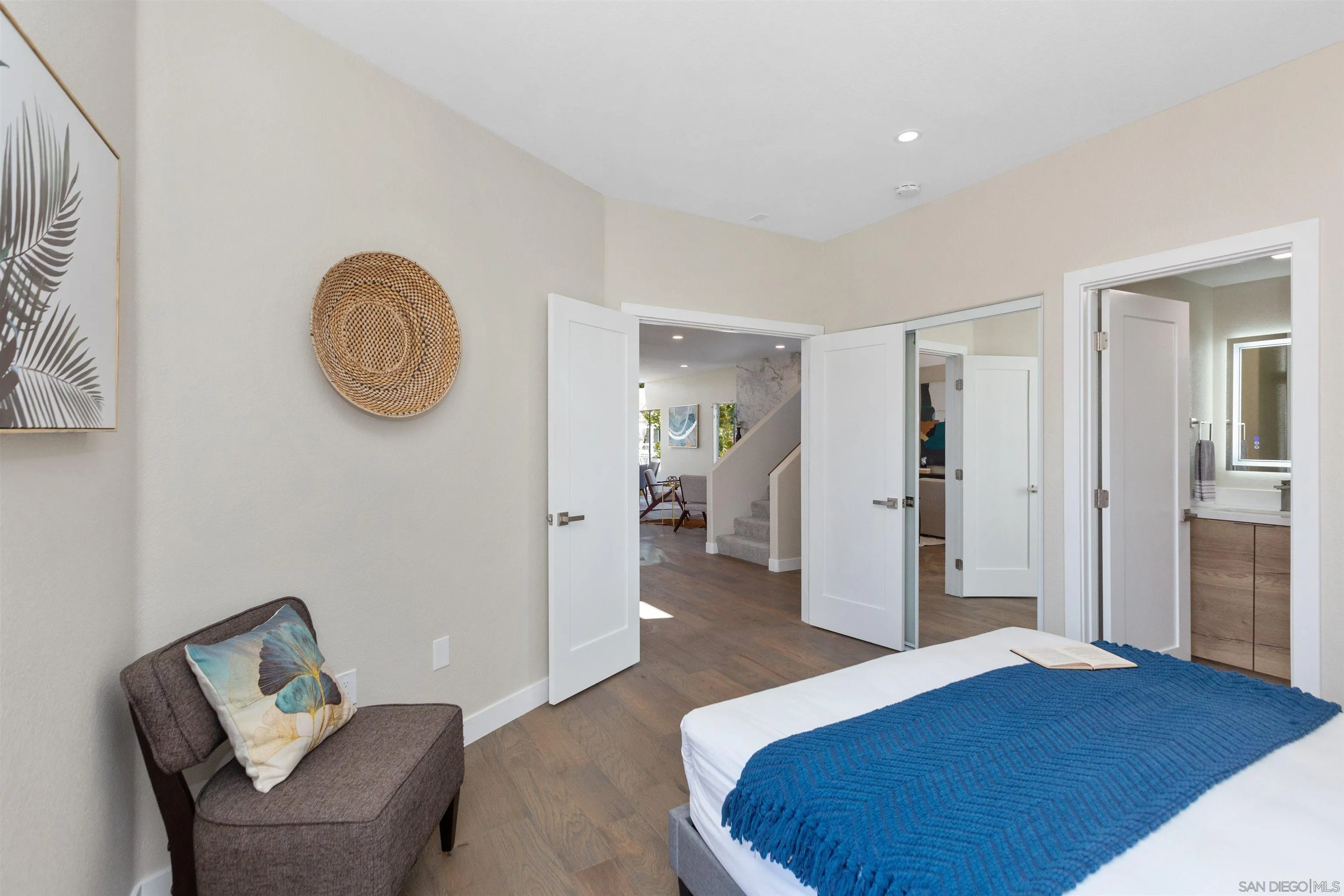4963 Pylos Way Oceanside, CA 92056 - Photo 41 of 53 a bedroom with a bed and a chair