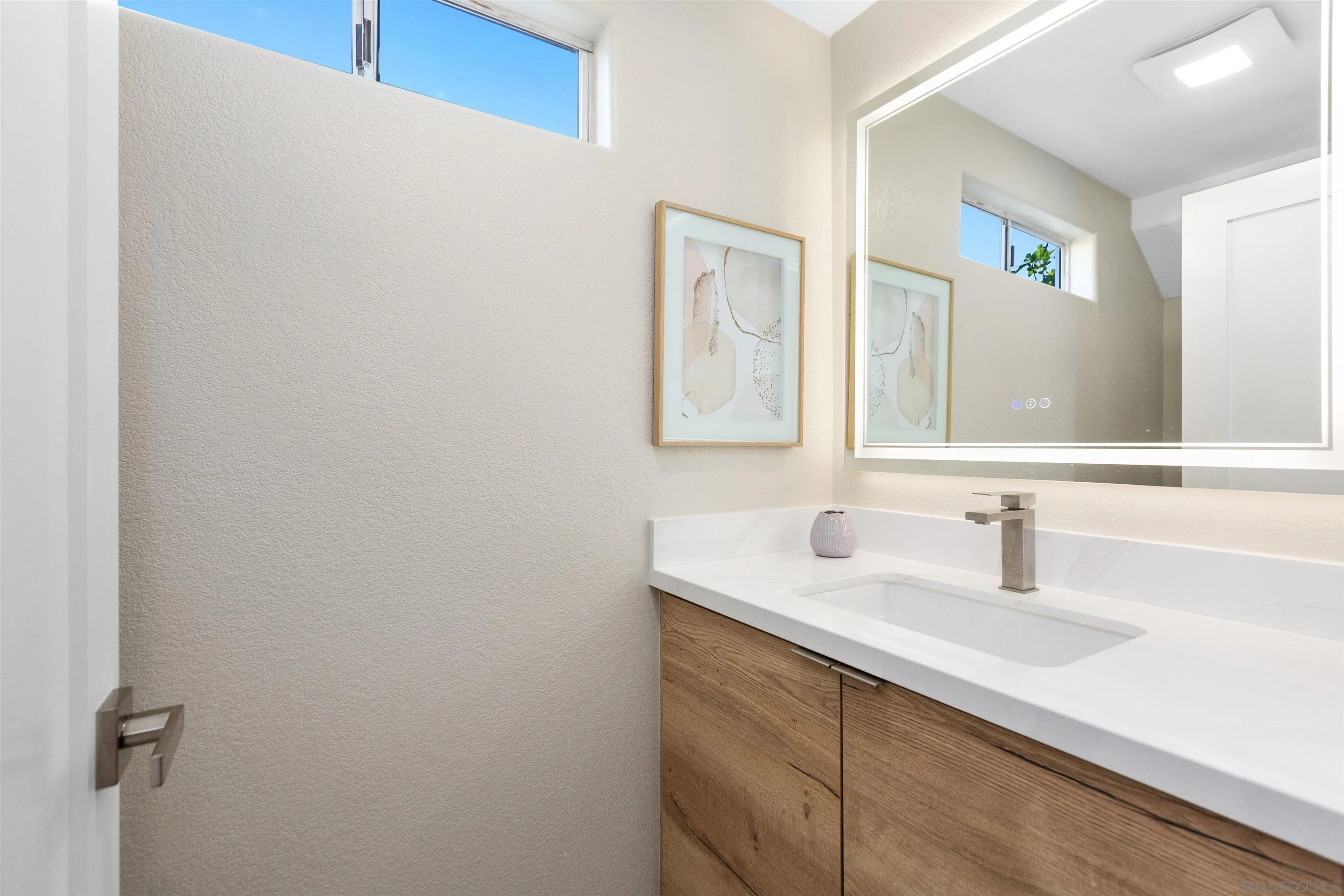 4963 Pylos Way Oceanside, CA 92056 - Photo 43 of 53 a bathroom with a sink and a mirror
