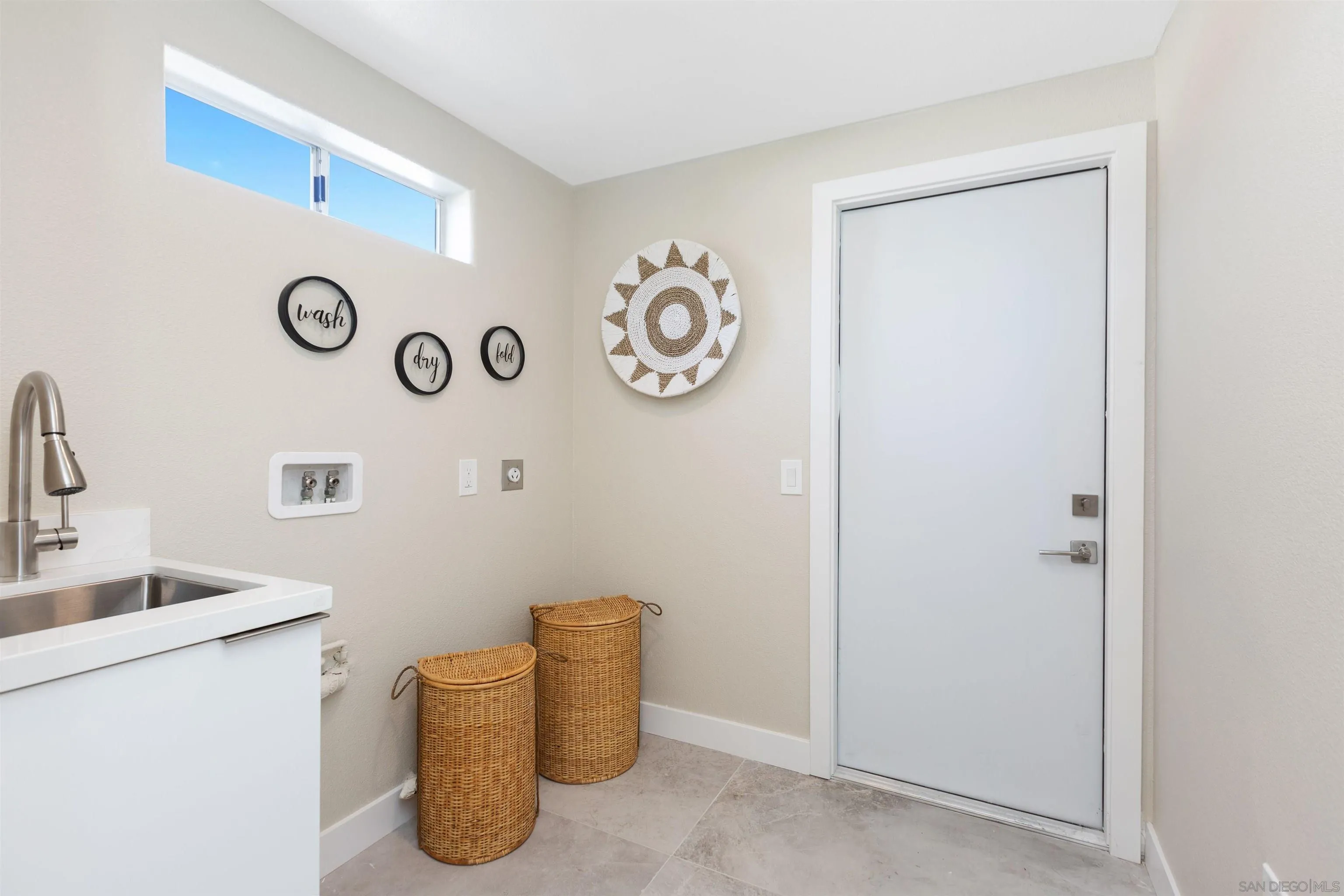 4963 Pylos Way Oceanside, CA 92056 - Photo 44 of 53 a view of livingroom with fridge and sink