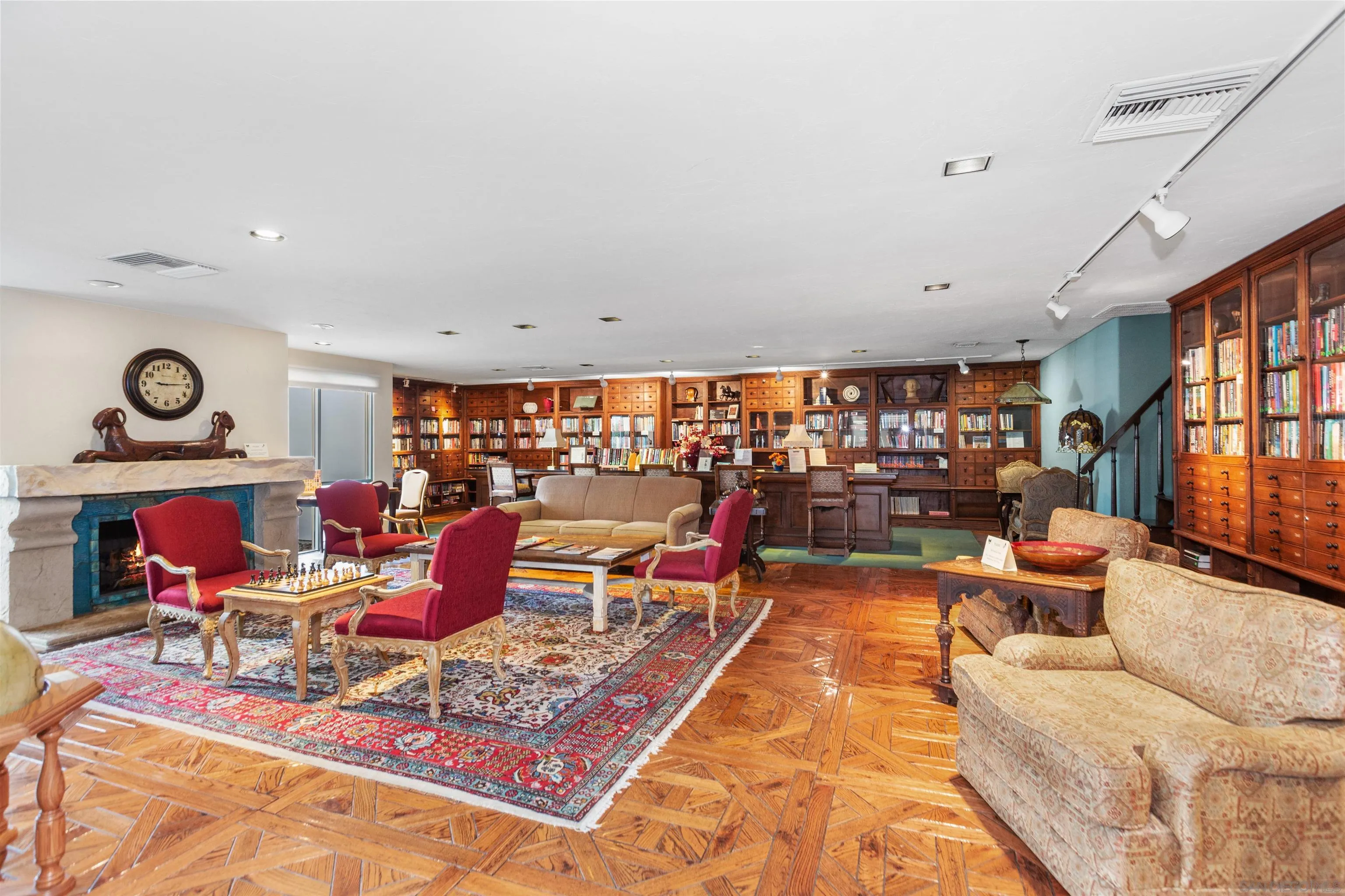 4963 Pylos Way Oceanside, CA 92056 - Photo 52 of 53 a living room with furniture a rug and a floor to ceiling window