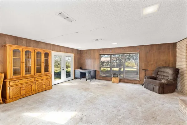 a large room with furniture and large windows