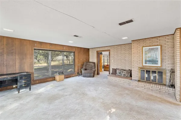 a large bedroom with furniture and large windows