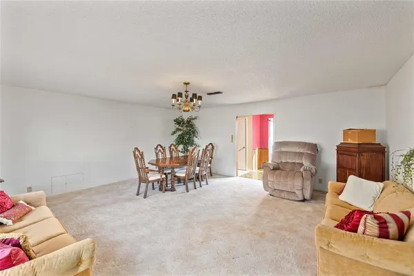 a dining room with furniture and window