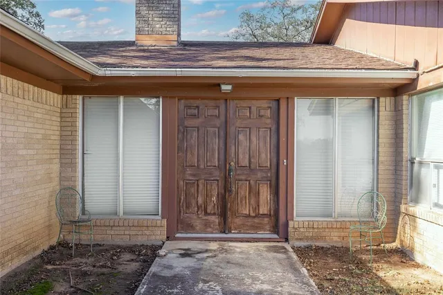 a view of entryway with a wooden door