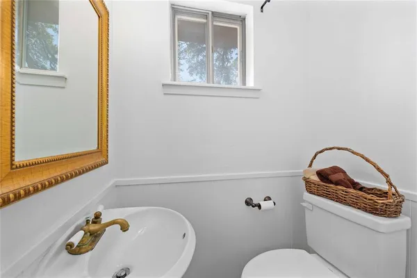 a bathroom with a toilet and a sink
