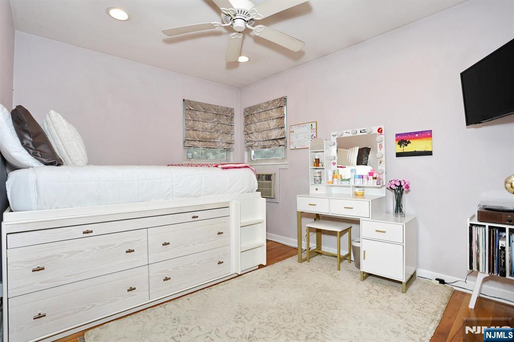 87 Barbara Road Dumont, NJ 07628 - Photo 24 of 48 a bedroom with a bed and a flat screen tv