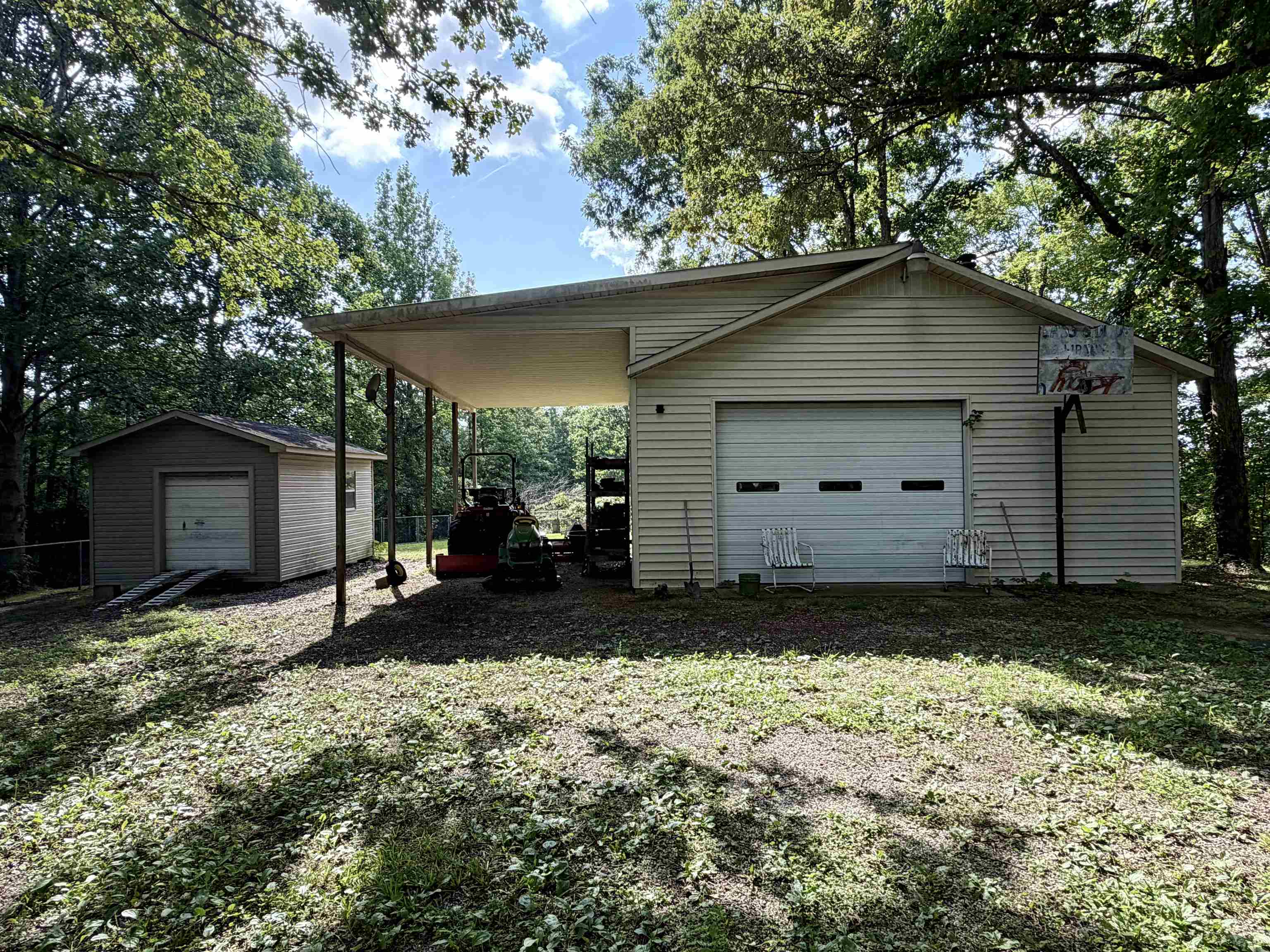 373 Clarence Barham Road Bethel Springs, TN 38315 - Photo 23 of 28 Detached garage featuring horizontal siding and a white paneled garage door