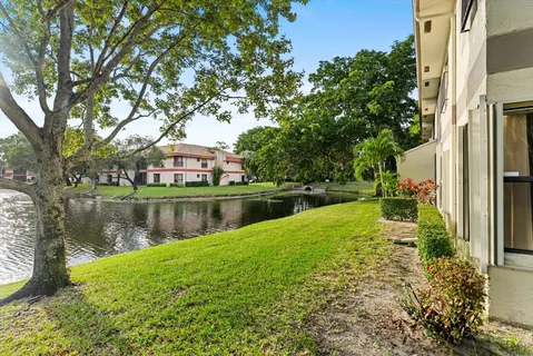 a backyard of a house with a lake view