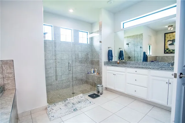 a bathroom with a tub and sink