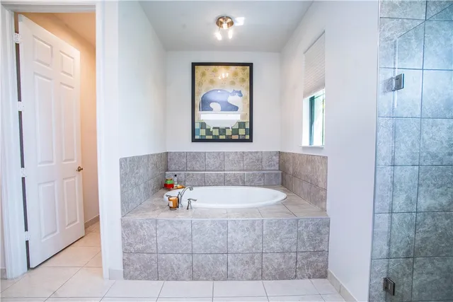 a view of a house with a yard and entertaining space