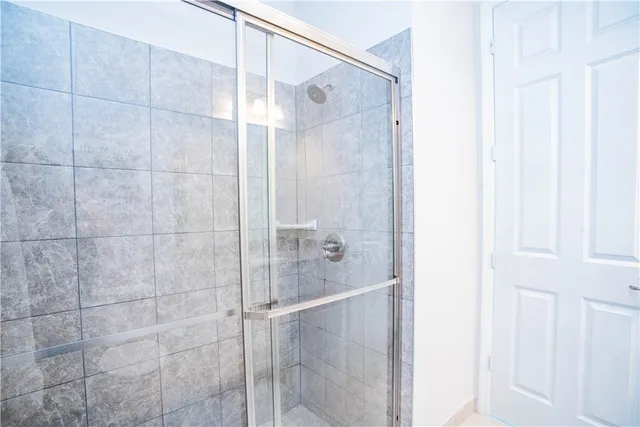 a bathroom with a bathtub and shower