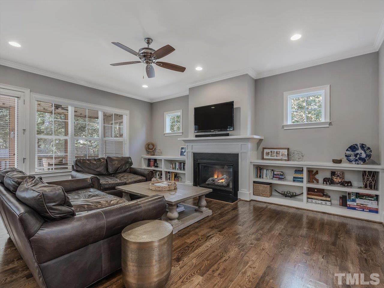 6427 Rosny Road Raleigh, NC 27613 - Photo 13 of 53 a living room with furniture and a fireplace