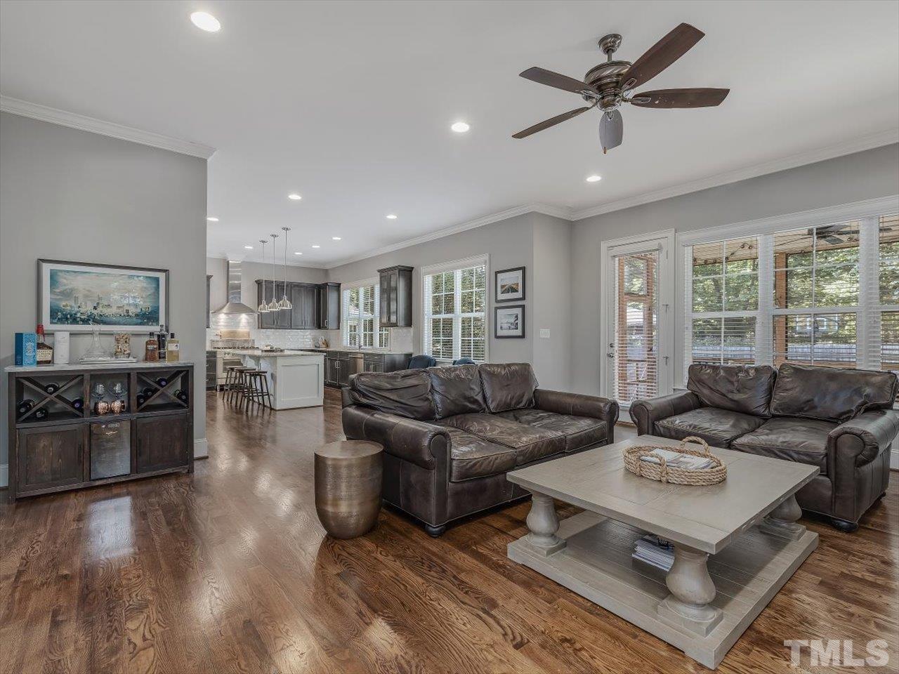 6427 Rosny Road Raleigh, NC 27613 - Photo 15 of 53 a living room with furniture kitchen view and a large window