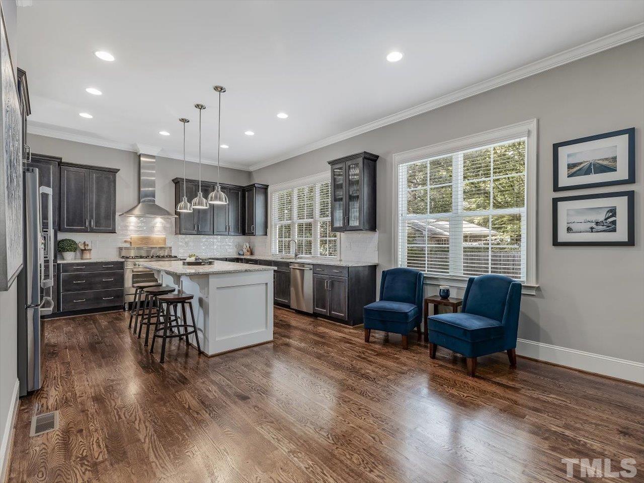 6427 Rosny Road Raleigh, NC 27613 - Photo 19 of 53 a living room with furniture and a large window
