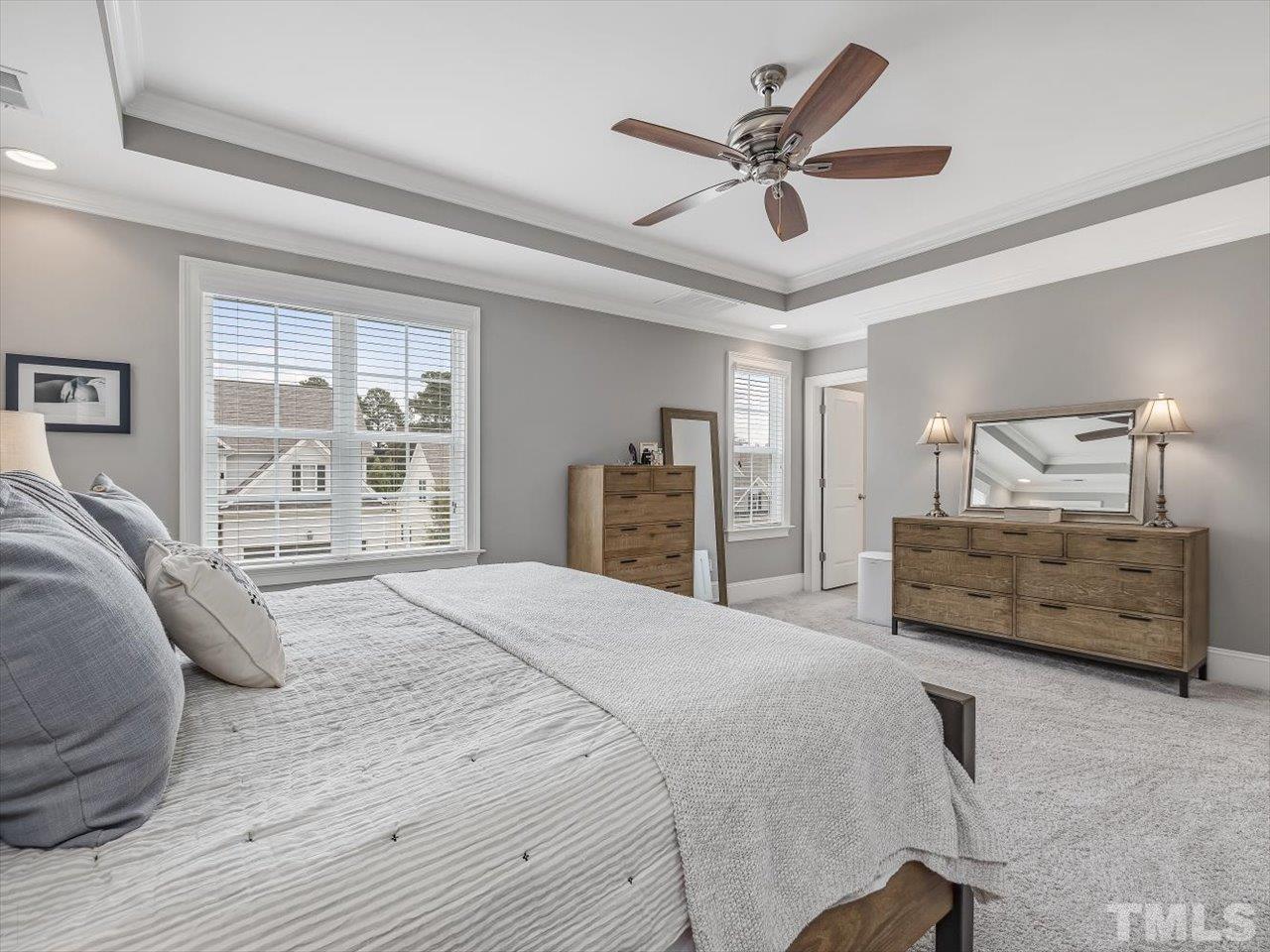 6427 Rosny Road Raleigh, NC 27613 - Photo 33 of 53 a bedroom with a bed a window and dresser