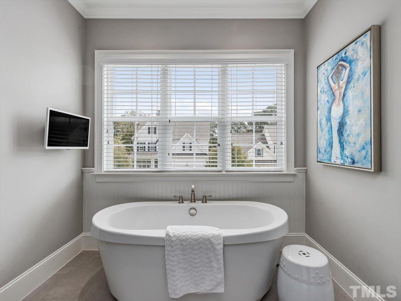 6427 Rosny Road Raleigh, NC 27613 - Photo 36 of 53 a white bath tub sitting next to a window