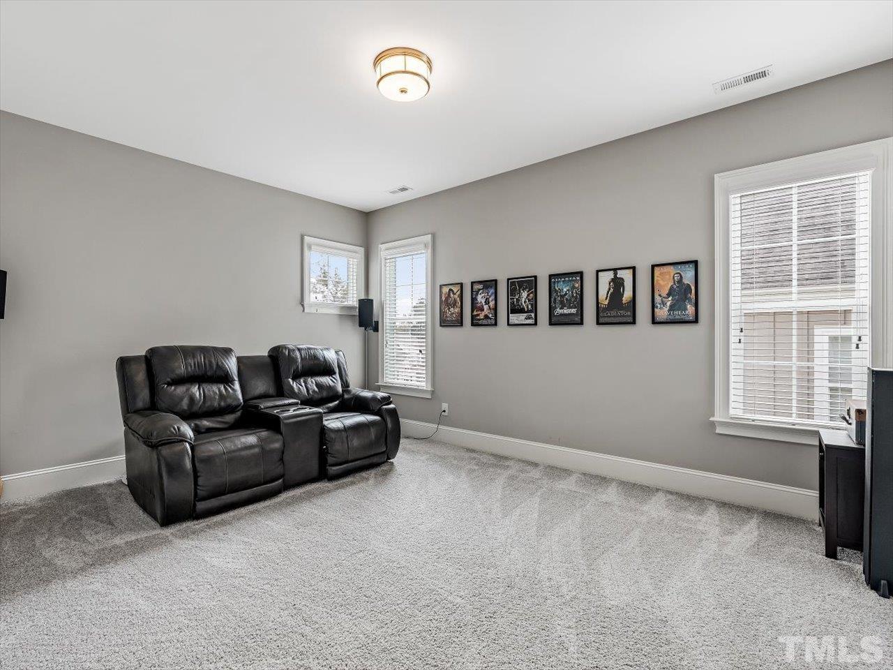 6427 Rosny Road Raleigh, NC 27613 - Photo 40 of 53 a living room with furniture and windows