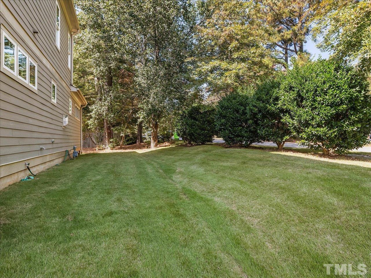6427 Rosny Road Raleigh, NC 27613 - Photo 50 of 53 a view of outdoor space with deck and yard