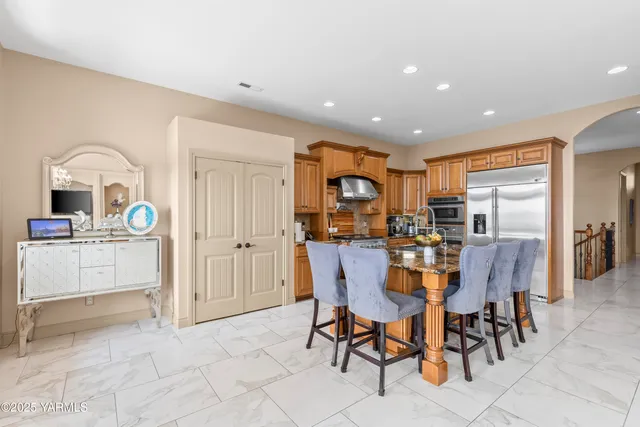 a dining area with furniture and a window