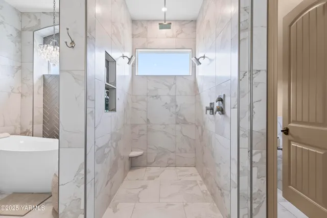 a bathroom with a shower and a toilet
