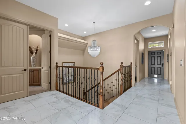 a utility room with cabinets washer and dryer