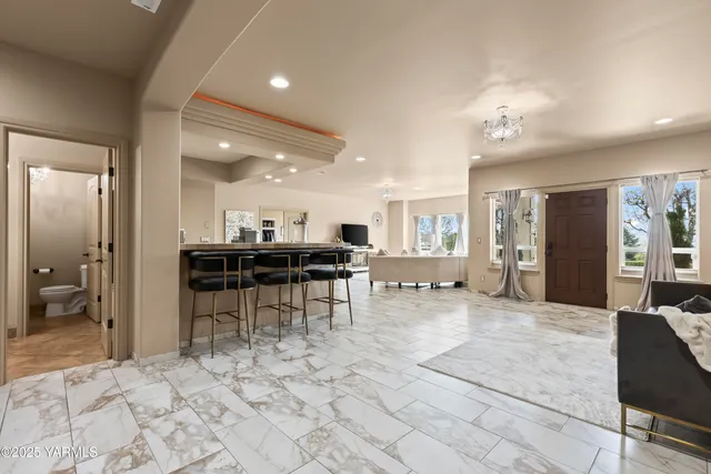 a view of a living room and kitchen