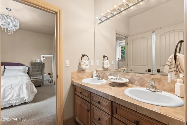 a bedroom with a bed and a table