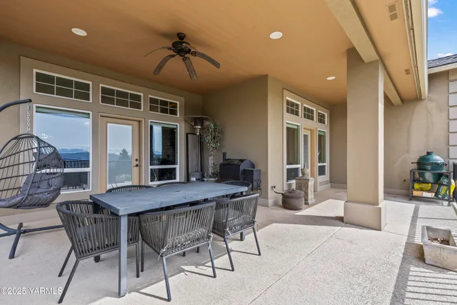 a view of swimming pool with an outdoor seating