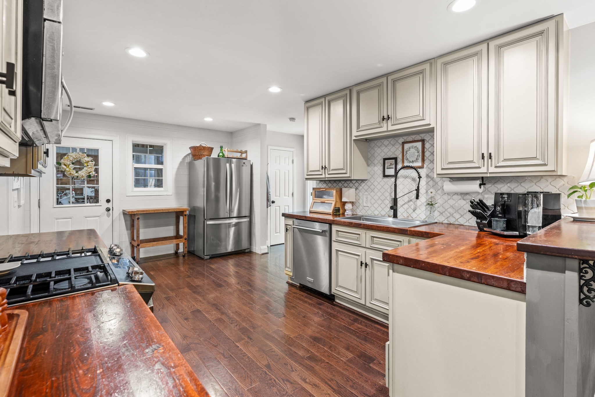 1517 Motlow College Road Normandy, TN 37360 - Photo 20 of 78 a kitchen with stainless steel appliances granite countertop a stove refrigerator and a sink