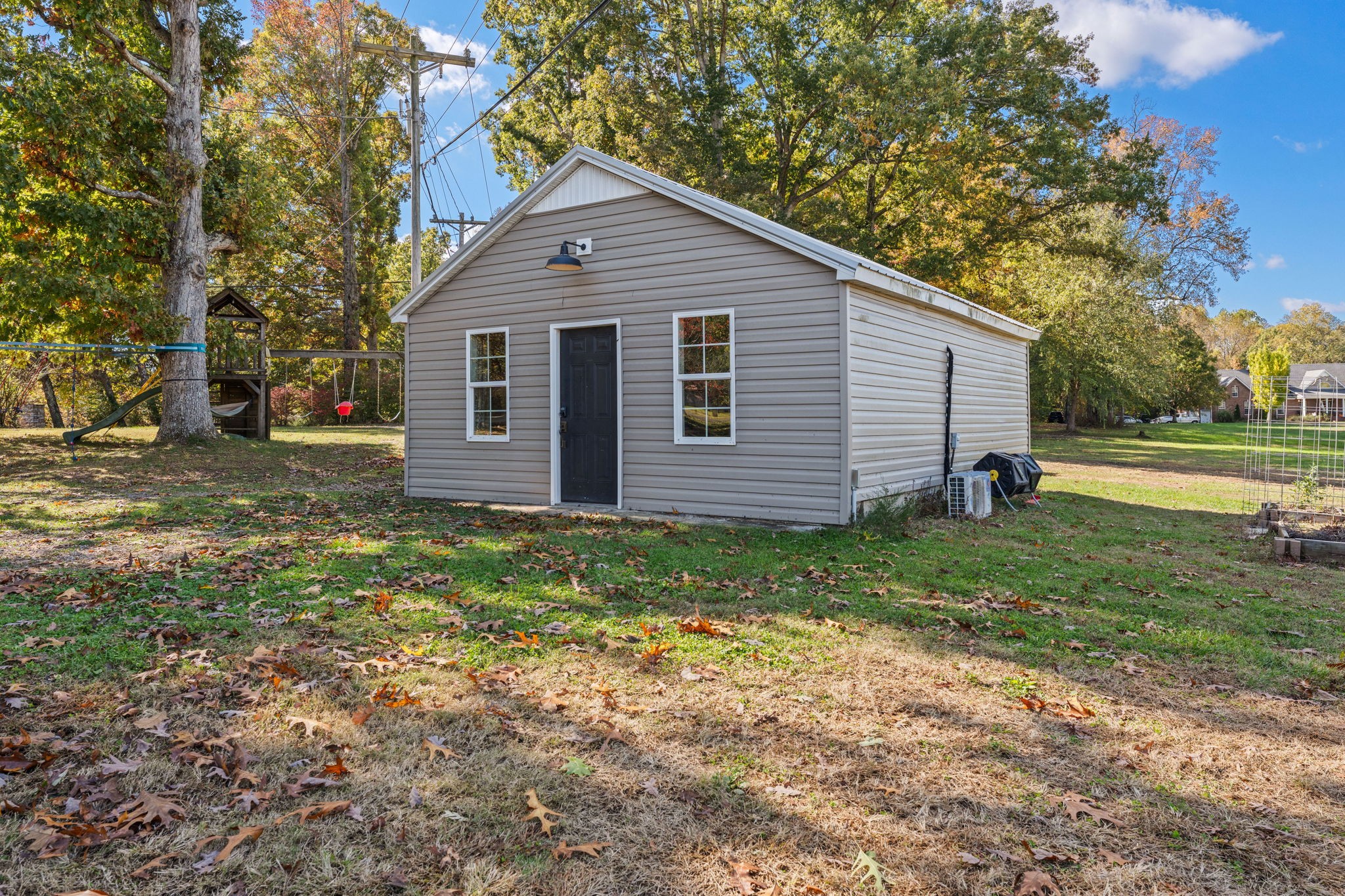 1517 Motlow College Road Normandy, TN 37360 - Photo 50 of 78 a backyard of a house with plants and large tree