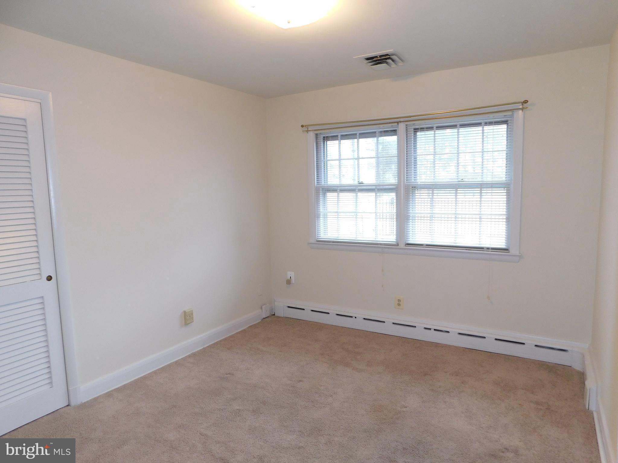 3855 Wayson Road Davidsonville, MD 21035 - Photo 15 of 27 Main Level Third Bedroom w/ Hardwoods Under Carpet