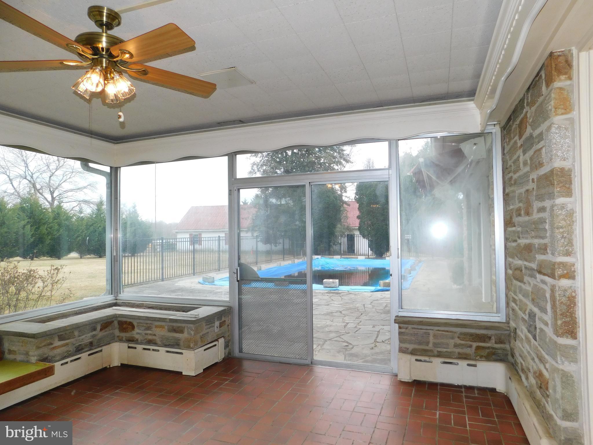 3855 Wayson Road Davidsonville, MD 21035 - Photo 10 of 27 Glass Enclosed Sun Room w/ Slider out to Pool