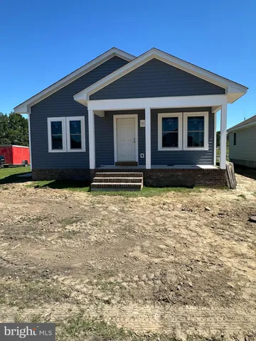 a view of house with yard