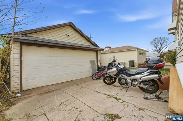 a view of a garage with parked cars