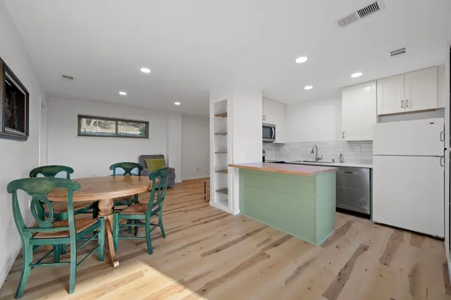 a view of kitchen with cabinets and wooden floor